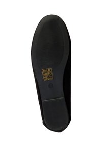 Semelle de chaussure noire avec adhérence texturée, taille 38, et symboles en matériau doré imprimés près de la zone de la voûte plantaire.