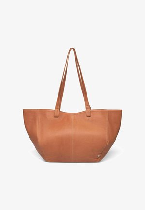Tan leather tote bag with two long handles, rounded shape, smooth texture, and subtle stitching details. No visible hardware or accents.