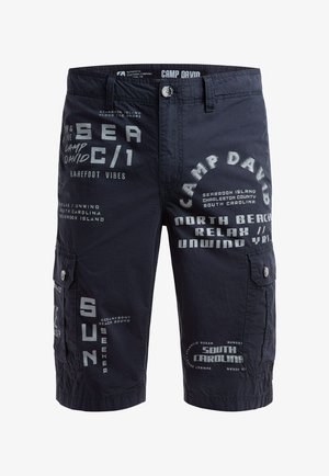 Navy cargo shorts with multiple white printed text phrases including "Camp David," "Sea," "North Beach," and "South Carolina."