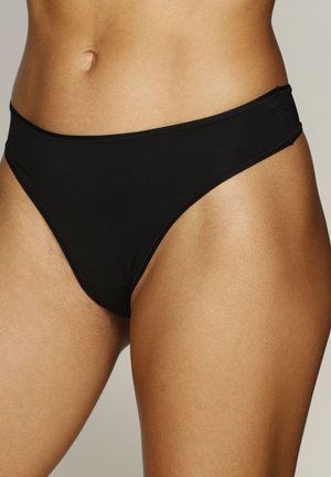 Zwarte bikini-broek gemaakt van soepel, rekbaar materiaal. Heeft een lage taille en minimale zijkantbedekking, zonder zichtbare patronen of accenten.