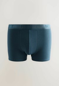 Boxer briefs da uomo in verde petrolio scuro con una cintura ampia che presenta la parola "NEXT" in una tonalità leggermente più scura.