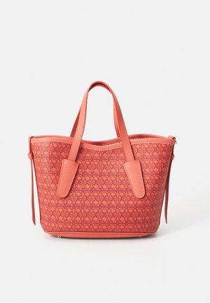 Coral tote bag with textured pattern, dual handles, and zip closure. Made from leather-like material, featuring a structured shape and smooth finish.