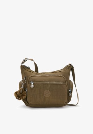 Ruskea kangas olkalaukku vetoketjullisilla taskuilla, teksturoidulla pinnalla, säädettävällä hihnalla ja avaimenperään kiinnitetty apinariipus.