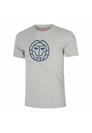 T-shirt gris clair à manches courtes avec un grand graphisme circulaire abstrait bleu foncé représentant un visage de robot sur la poitrine.