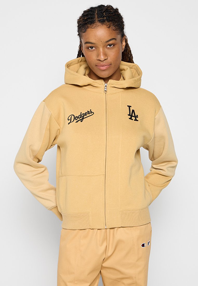 Beżowa bluza z zamkiem błyskawicznym, z kieszenią typu kangur, z czarnymi logo "Dodgers" i "LA". Gładka tekstura, kaptur z prążkowanymi detalami.