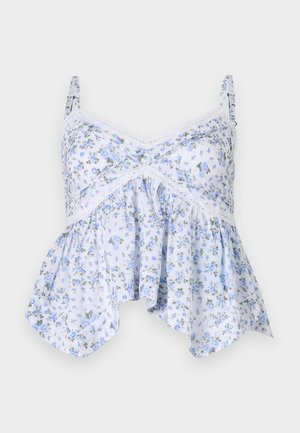 Šviesiai mėlyna gėlėta liemenėlė su plonais dirželiais, nėrinių detalėmis ir išsiplėtusiu siluetu. Medžiaga atrodo minkšta su subtiliu gėlių raštu.