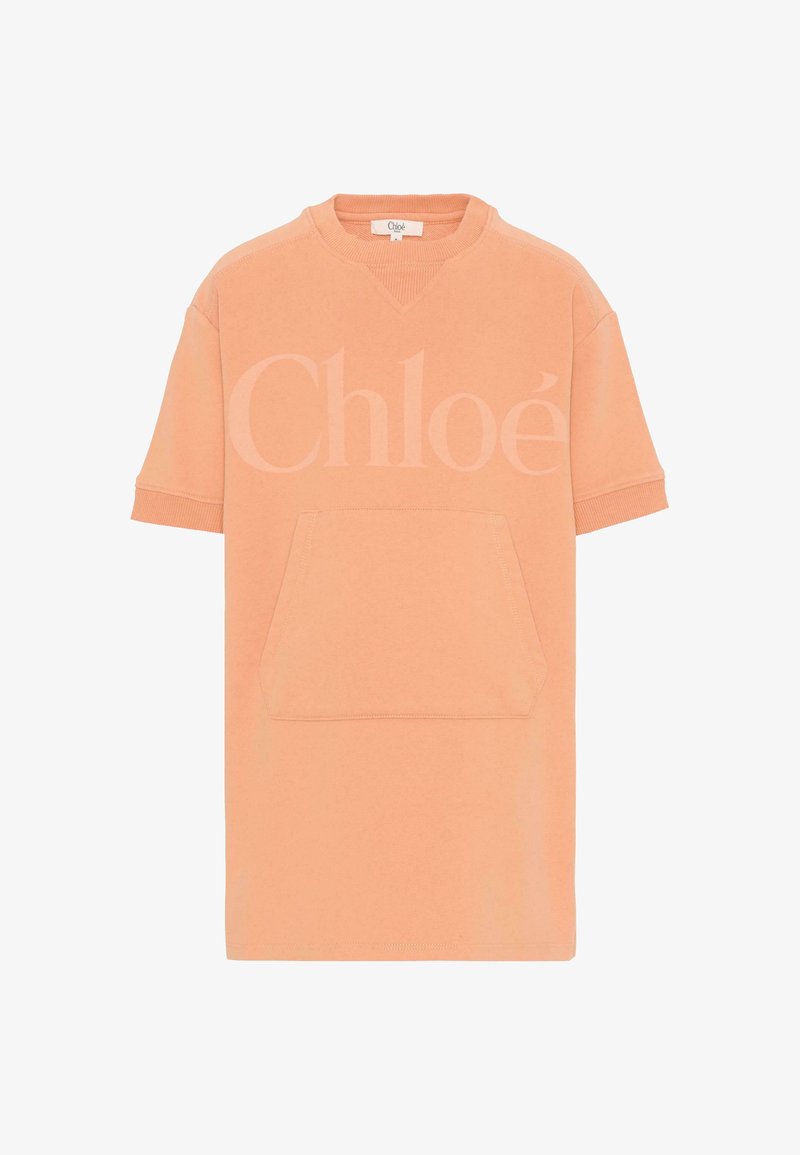 Robe-sweat à manches courtes couleur pêche avec poche kangourou à l'avant et logo "Chloé" subtilement embossé sur la poitrine.