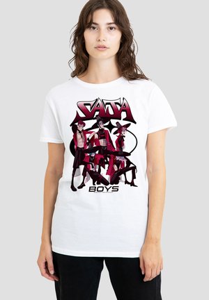 White cotton t-shirt with a graphic print of four characters in red and black attire, featuring the text "SAJA BOYS" at the bottom.