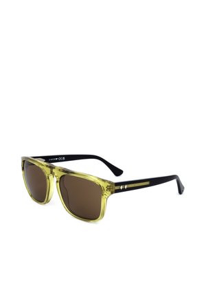 Occhiali da sole anteriori trasparenti gialli con lenti marrone scuro e aste nere con un piccolo dettaglio metallico sulla stanghetta.