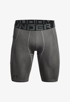 Shorts de sport ajustés gris avec une taille noire à logo. Fabriqués en tissu lisse et texturé avec des coutures renforcées et des contours.