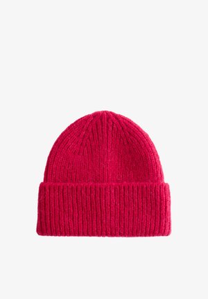 Knit beanie in bright red, featuring vertical ribbing, a folded cuff, and a soft, textured finish. Suitable for cold weather wear.