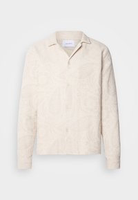 Kortärmad skjorta i ljus beige tyg med texturerat blommönster, klassisk krage och knäppning framtill. Skuren passform.