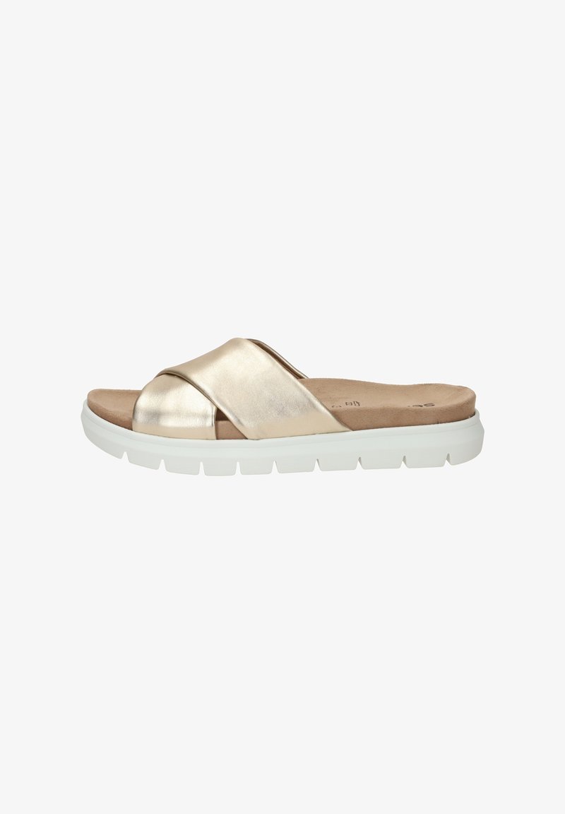 Sandale glissière métallique dorée avec des lanières croisées, semelle intérieure rembourrée et semelle extérieure en caoutchouc blanc. Texture lisse, design minimaliste.