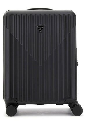 Hard-shell suitcase in black, featuring vertical ridges, a triangular brand emblem, and four multi-directional wheels for mobility.