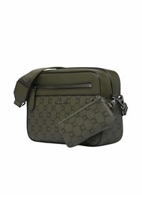 Sac bandoulière vert olive avec motif circulaire en relief, compartiment zippé, sangle réglable et porte-cartes détachable.