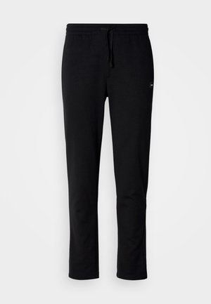 Sorte sweatpants lavet af blødt stof, med en elastisk talje med snoretræk og en slim fit design. Ingen synlige mønstre eller accenter.