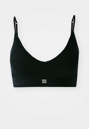 Bralette noir à côtes avec un design en V. Doté de bretelles réglables et d'une bande logo en bas avec "HUGO" en lettres blanches.
