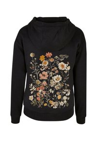 Felpa nera con un design floreale in morbidi toni pastello sulla parte posteriore. Caratterizzata da un cappuccio con lacci e polsini e orlo a coste. Tessuto morbido e accogliente.