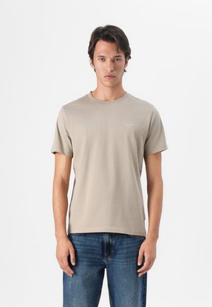 Beige bomulds T-shirt med rund halsudskæring og korte ærmer. Har et lille logo på brystet og en afslappet pasform med en glat tekstur.