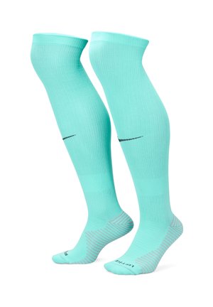 Calze compressive turchesi con design a coste, dotate di un logo nero e di un motivo a strisce sulle suole per una migliore aderenza.