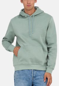 Lys grøn hoodie med snøre, frontlomme og ribbede manchetter. Fremstillet af blødt stof, har en afslappet pasform og en uformel stil.