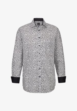 Camicetta bianca con un motivo floreale nero, colletto a camicia con bottoni e polsini neri. Presenta una vestibilità regolare e una texture del tessuto liscia.