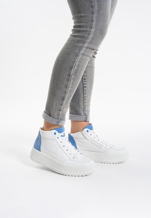 White high-top sneakers with light blue accents, made of leather and textile, featuring a textured sole and zipper detail on the side.