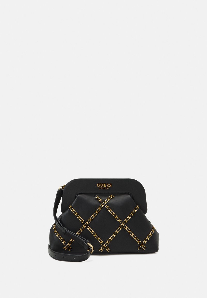 Black faux leather handbag with a structured design, gold-tone chain accents in an X pattern, and a detachable shoulder strap. Gold logo on the front.