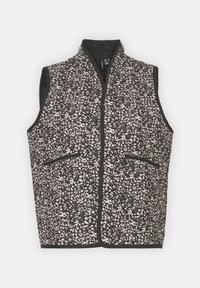 Veste matelassée sans manches avec petit motif floral noir et blanc, bordure noire et deux poches avant.
