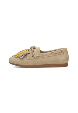 Beige suede flat loafer with brown sole, decorative laces, and tassels in yellow, gray, and beige on the front.