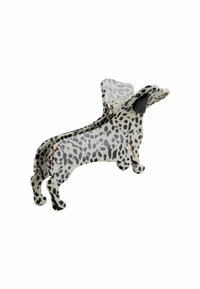 En klämma formad som en tax, tillverkad av ett glänsande material, med en vit bas och svarta fläckar samt detaljerade öron. Designen betonar den lekfulla formen.