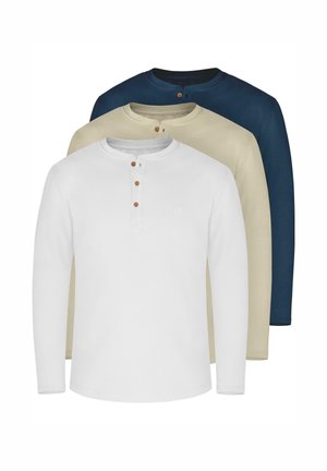 Drei Langarmhemden in Weiß, Beige und Marineblau, mit Rundhalsausschnitt, Knopfleiste und aus weichem Baumwollmaterial.