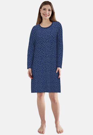 Navy polka dot dress with long sleeves, round neckline, and mid-thigh length. Made from soft fabric with a smooth texture.