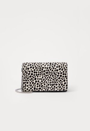 Black and white spotted patterned clutch bag with a chain strap, smooth texture, and sleek rectangular design; features metallic logo detail.