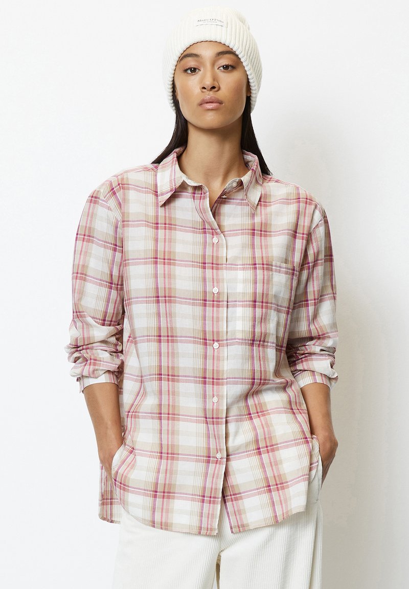 Checkered shirt in pastel colors, featuring pink, white, and beige patterns. Long sleeves rolled up, button front, and a pocket on the chest.