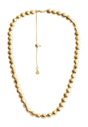 Goldene Perlenkette mit kugelförmigen Perlen in unterschiedlichen Größen, einem sicheren Verschluss mit verstellbarer Kette und einem kleinen hängenden Akzent.