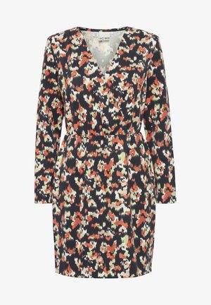 Vaatetusliivi tummansinisestä kankasta, jossa on värikäs abstrakti kuvio punaisilla, valkoisilla ja vihreillä sävyillä. Pitkät hihat ja avara vyötärö.