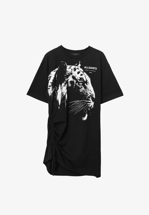 T-shirt oversize nera con una grafica di una tigre bianca sul davanti. Presenta dettagli arricciati sui lati. Realizzato in morbido cotone.