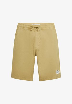 Bañador beige con cintura elástica, cordón ajustable y bolsillos laterales. Cuenta con un pequeño logo circular en el muslo izquierdo.