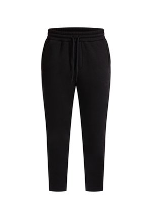 Zwarte sweatpants van zacht materiaal, met een verstelbare tailleband, zijzakken en een taps toelopend ontwerp.