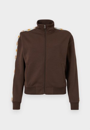 Brown zip-up jacket in soft fabric, featuring a high collar, side pockets, and patterned accents along the shoulders. Ribbed cuffs and hem.