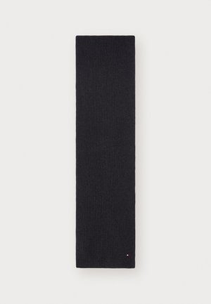 Scarf a maglia a coste di un blu navy scuro, forma rettangolare, superficie liscia, con un sottile accento del marchio nell'angolo.