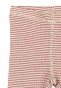 Leggings a rayas de suave algodón con franjas horizontales alternando entre rosa y crema. Presentan una delgada cintura elástica con costuras planas.