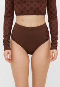 Brauner hochgeschnittener Bikiniunterteil mit floralen Mustern, aus glattem, dehnbarem Stoff. Verfügt über einen sauberen Abschluss an den Kanten.