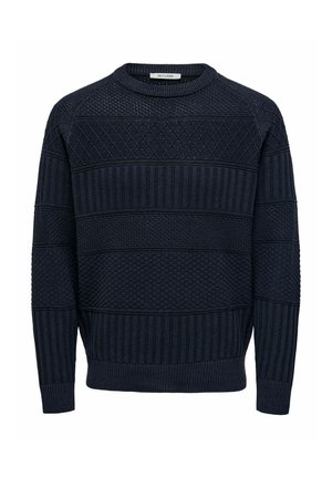 Tumši zils džemperis ar teksturētu dizainu, kas ietver dimanta un ribu rakstus. Apaļa apkakle un ribotas piedurknes un apakšmala. Izgatavots no adīta auduma.