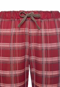 Red plaid pants featuring a drawstring waist, a mix of dark and light check patterns, and a soft, textured fabric.