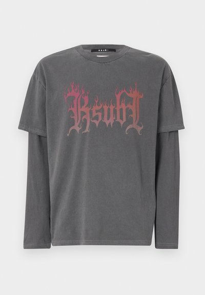 Gray long-sleeve t-shirt featuring a bold flame-patterned graphic in shades of red and pink, made from soft, textured cotton fabric.