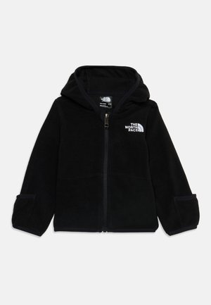 Čierna fleecová bunda s kapucňou na zips s logom The North Face na ľavej strane hrudníka a dlhými rukávmi s nastaviteľnými manžetami.