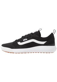 Black athletic shoe with a textured upper, white side stripe, and a chunky white midsole. Features a rubber outsole for grip. Lightweight design.