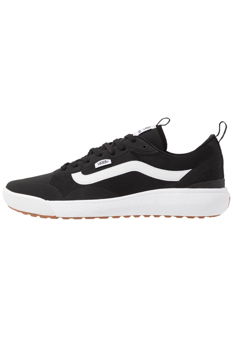 Black athletic shoe with a textured upper, white side stripe, and a chunky white midsole. Features a rubber outsole for grip. Lightweight design.